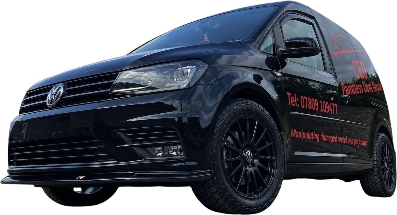 The CEO Paintless Dent Repair van, a black Volkswagen Caddy signwritten with the company logo, phone number and the line Manipulating damaged metal into perfection.