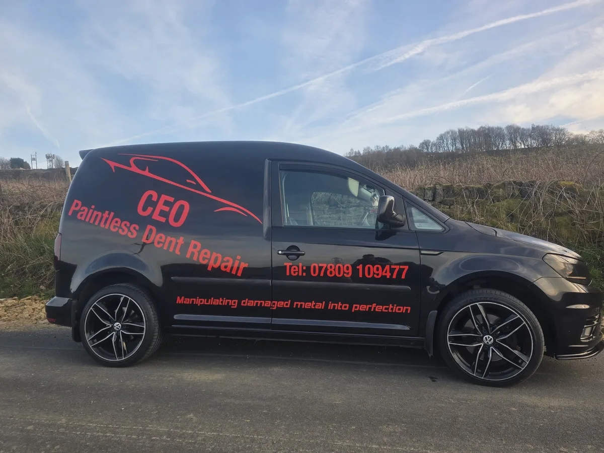 The CEO Paintless Dent Repair van parked on a country lane, signwritten down the side with the company logo, the phone number and the line Manipulating damaged metal into perfection.